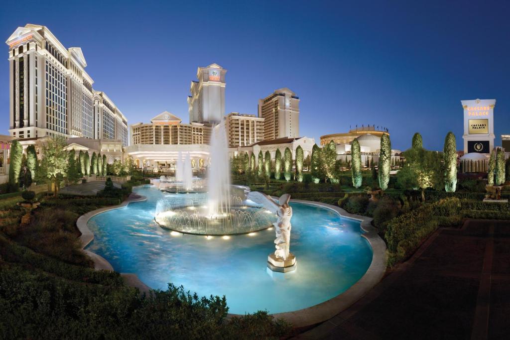 a large fountain in front of a large building at Nobu Hotel at Caesars Palace in Las Vegas