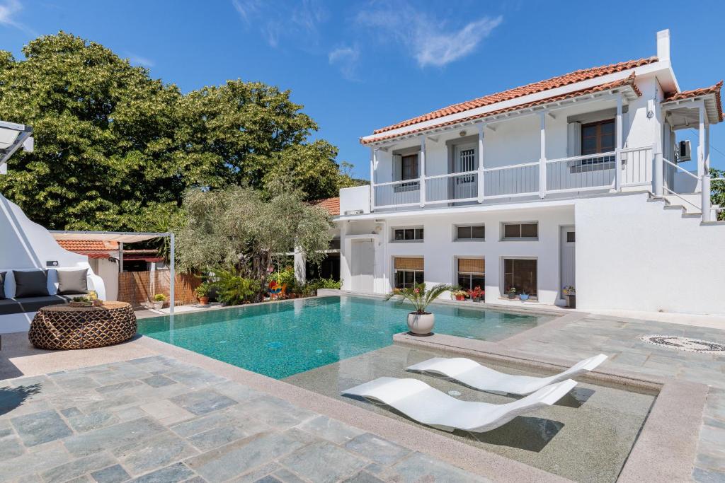 an image of a villa with a swimming pool at Terpsis Origin Villa in Stafylos