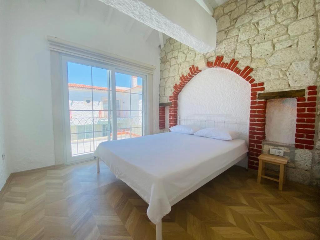 Ένα ή περισσότερα κρεβάτια σε δωμάτιο στο GK HoUsE