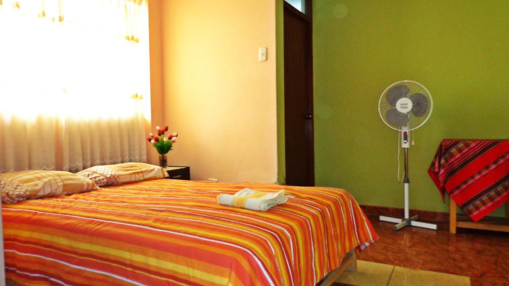 Postel nebo postele na pokoji v ubytování Hostal Geminis