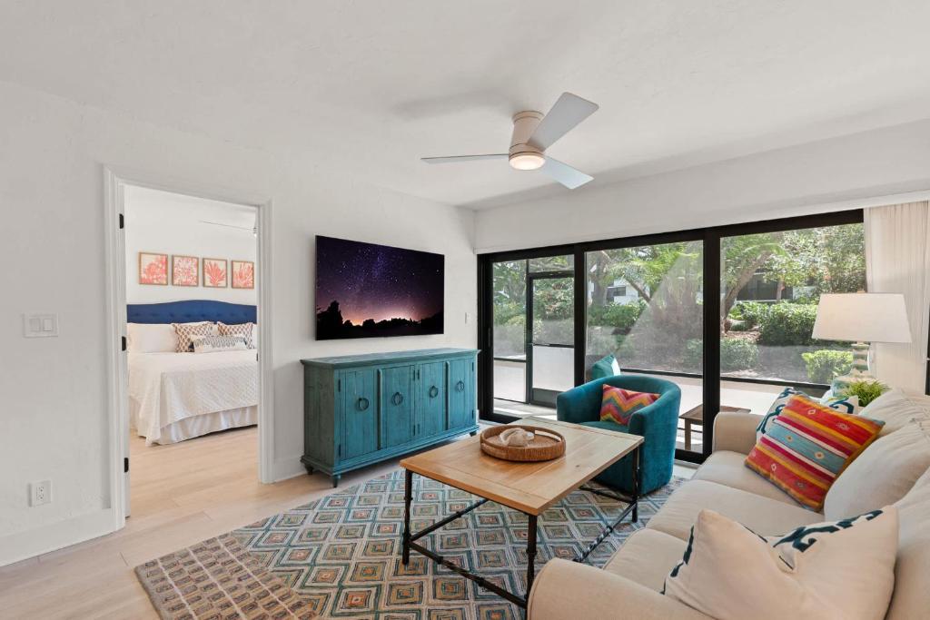 a living room with a couch and a table at Exquisite Luxury First Floor Condo - Easy Walk to Amenities in Naples