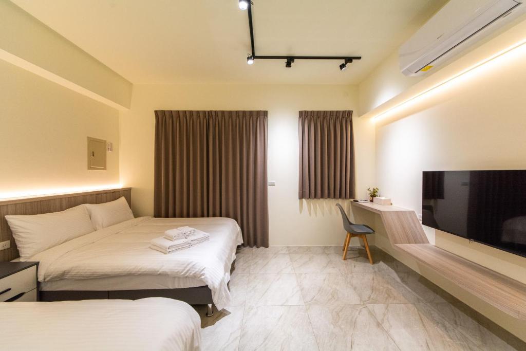 TV a/nebo společenská místnost v ubytování Langchao B&B