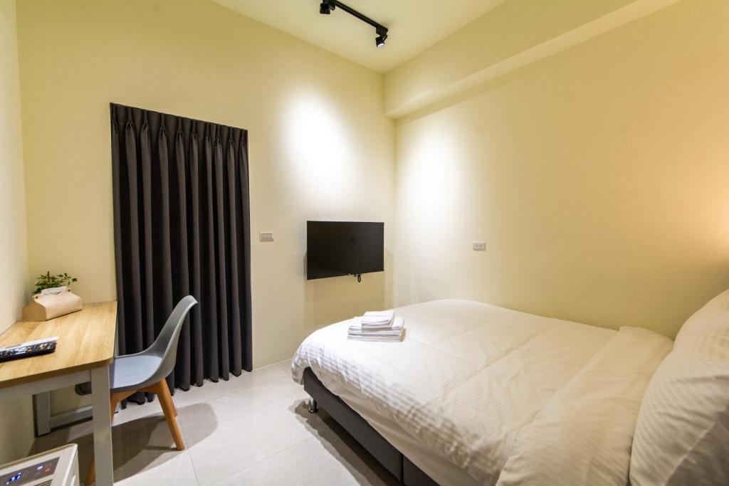 TV a/nebo společenská místnost v ubytování Langchao B&B