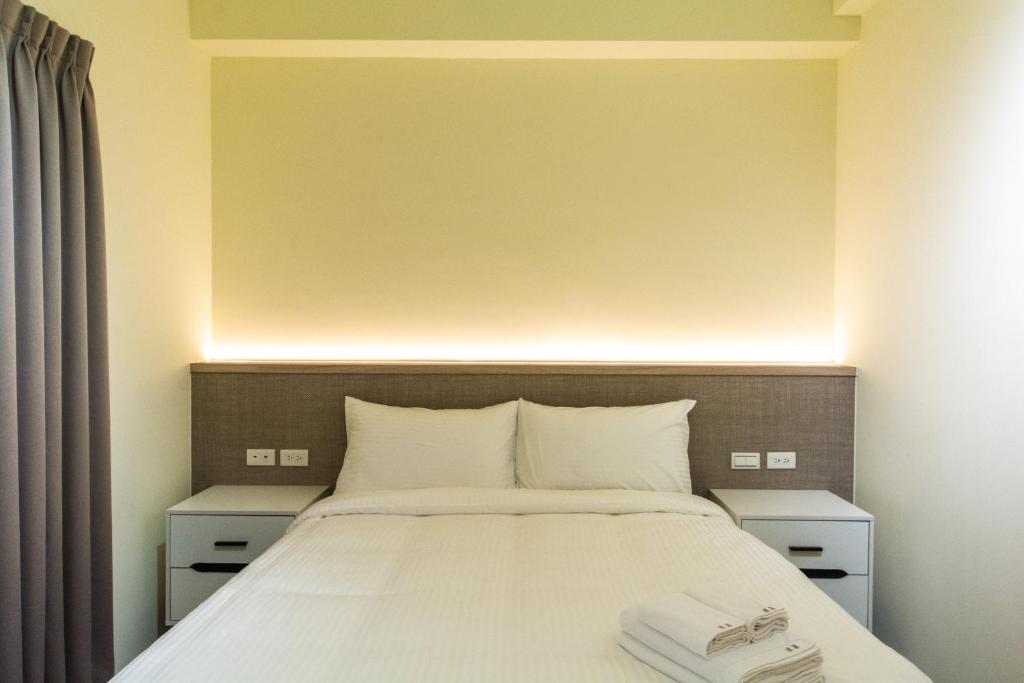 Postel nebo postele na pokoji v ubytování Langchao B&B
