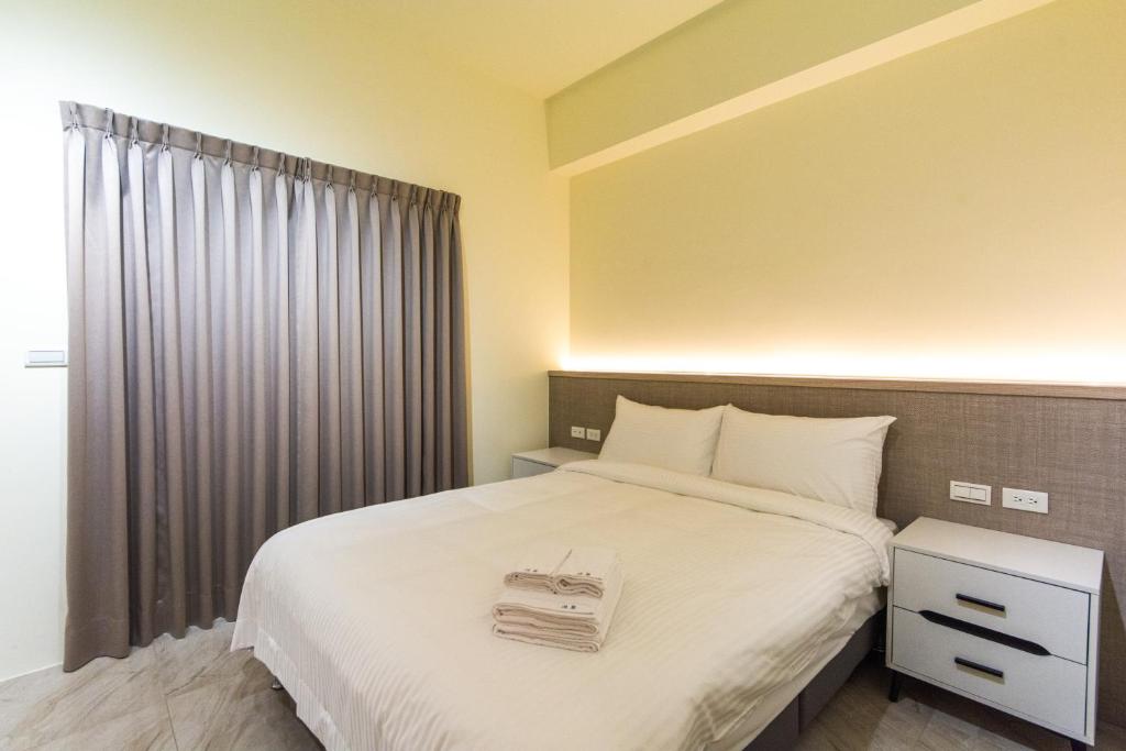 Postel nebo postele na pokoji v ubytování Langchao B&B