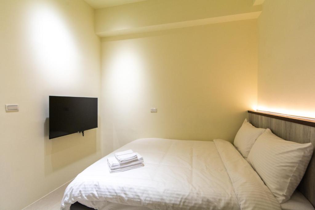 Postel nebo postele na pokoji v ubytování Langchao B&B