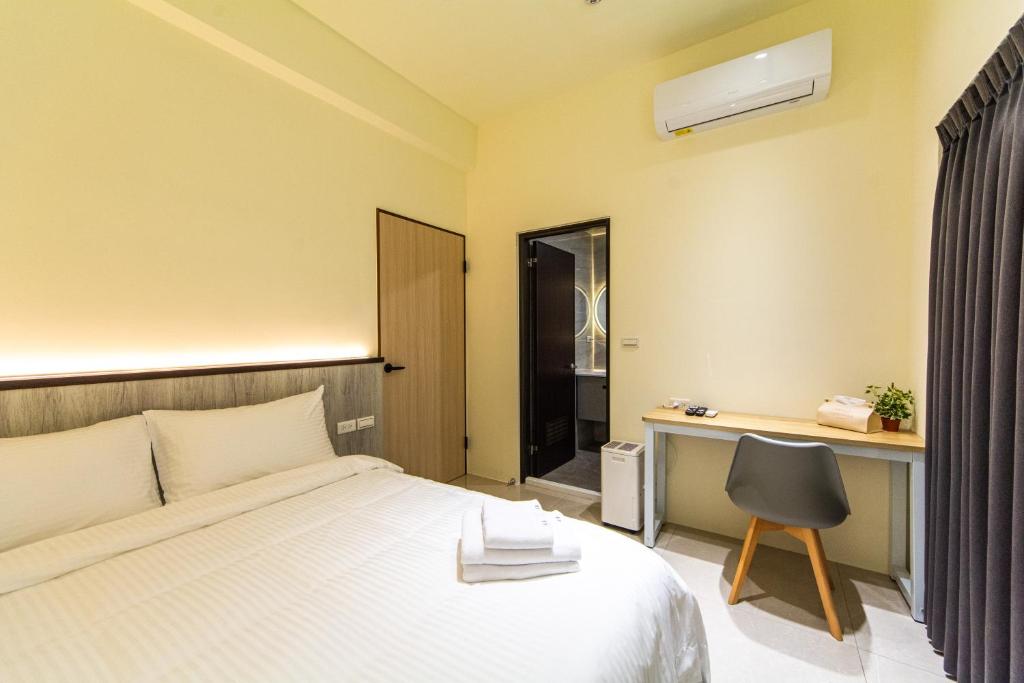 Postel nebo postele na pokoji v ubytování Langchao B&B