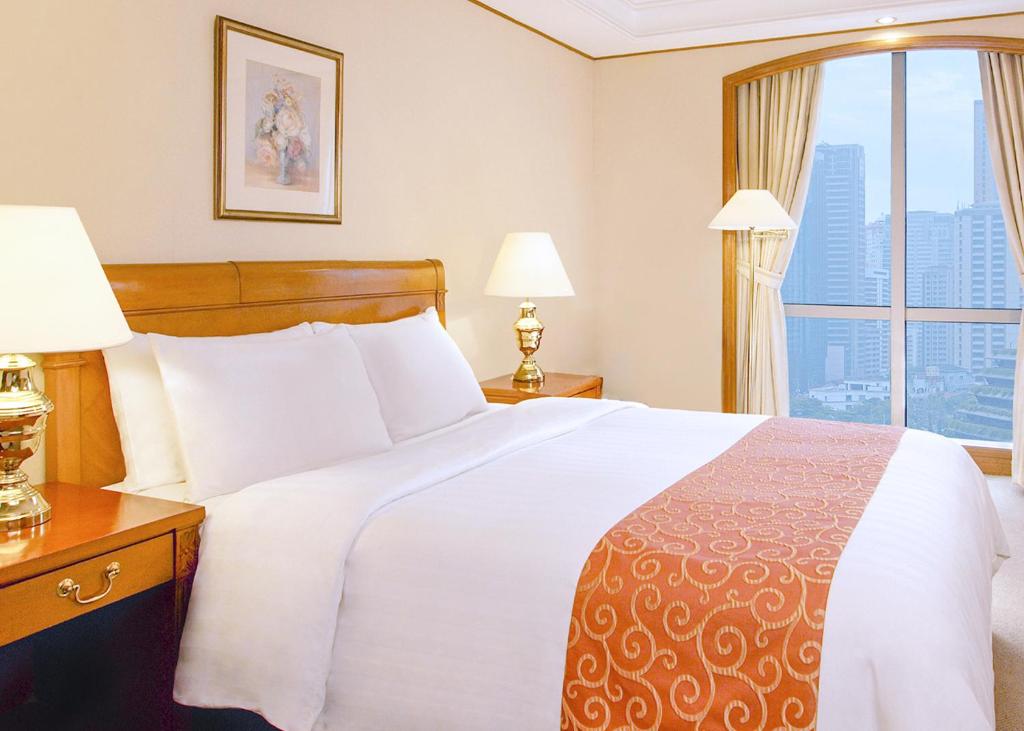 Postel nebo postele na pokoji v ubytování Richmonde Hotel Ortigas, Manila