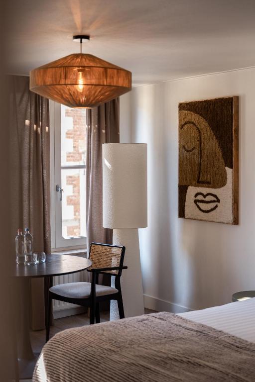 Postel nebo postele na pokoji v ubytování Le Virage bistro en hotel