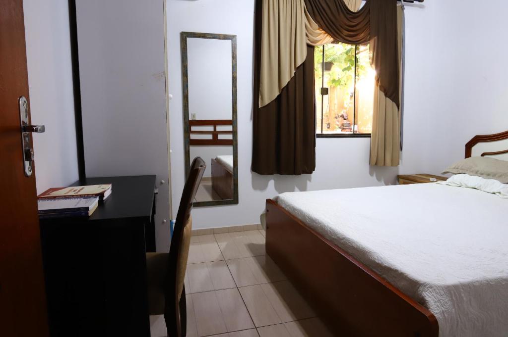 Postel nebo postele na pokoji v ubytování Quarto em Foz do Iguaçu