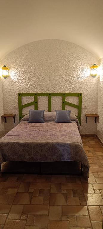 Postel nebo postele na pokoji v ubytování Cuevas Uropia