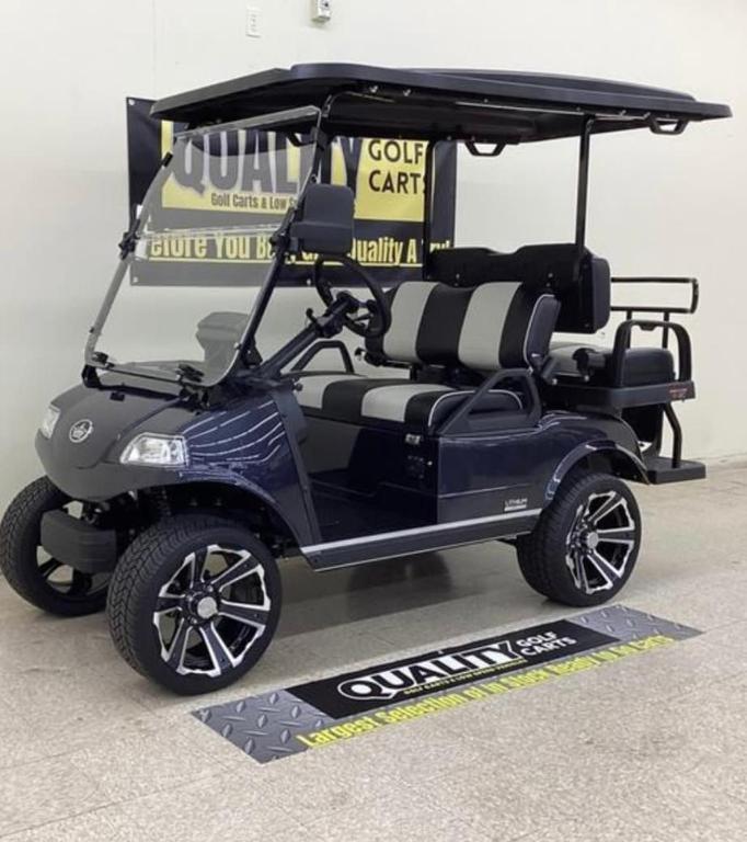 a golf cart sitting on top of a table at Cozy Family Stay- Queen-Double-Twins Bed- Full Kitchen-Netflix-Golf Cart-WiFi in Okahumpka