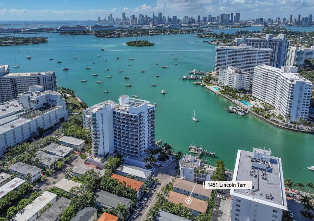 an aerial view of a harbor with buildings and a city at Lux Designer Apt 2BR and 2BA in the Heart of MIA Beach in Miami Beach