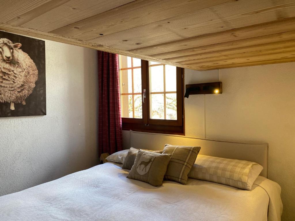 Postel nebo postele na pokoji v ubytování Wonderful apartment overlooking the Swiss alps