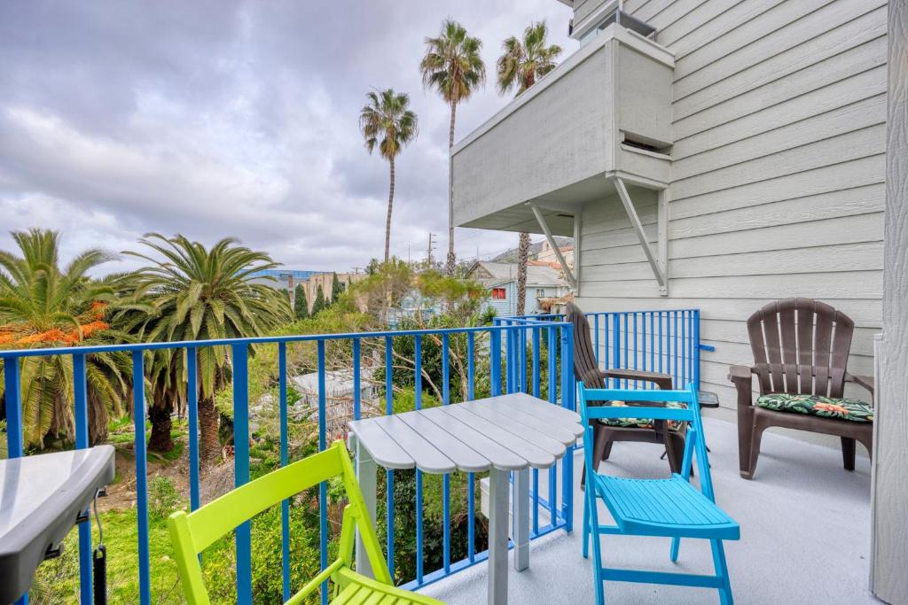 a balcony with chairs and a table and a table at 217W 217 Whittley Ave in Avalon
