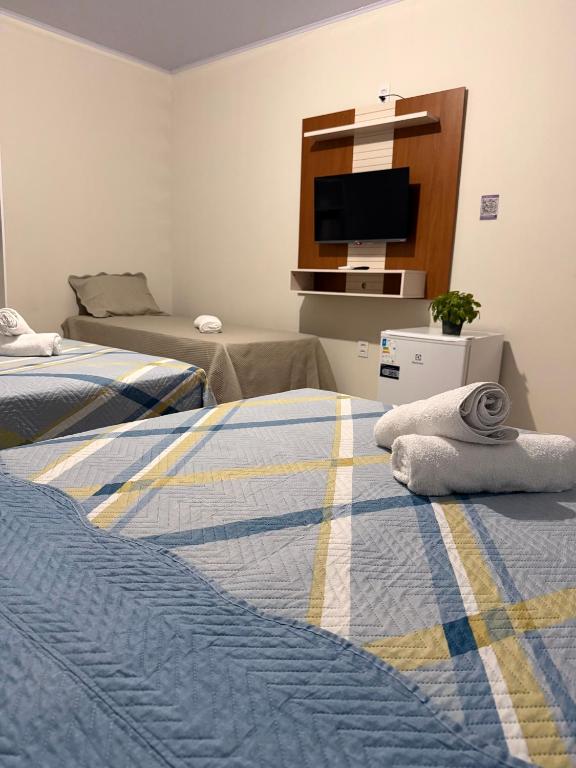 Postel nebo postele na pokoji v ubytování Pousadinha do seu Manoel