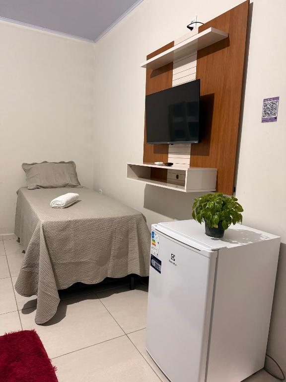 Postel nebo postele na pokoji v ubytování Pousadinha do seu Manoel