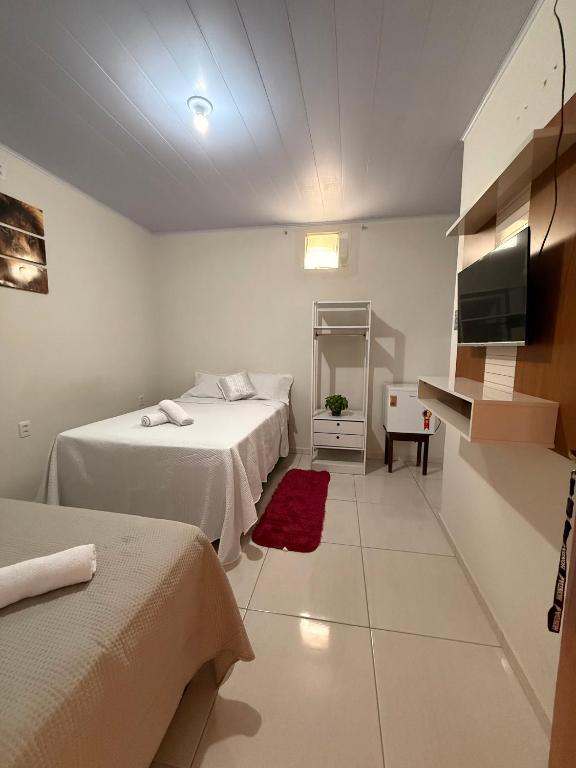 Postel nebo postele na pokoji v ubytování Pousadinha do seu Manoel