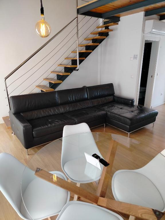 A seating area at Apartamentos Centro Cordoba by MiRa