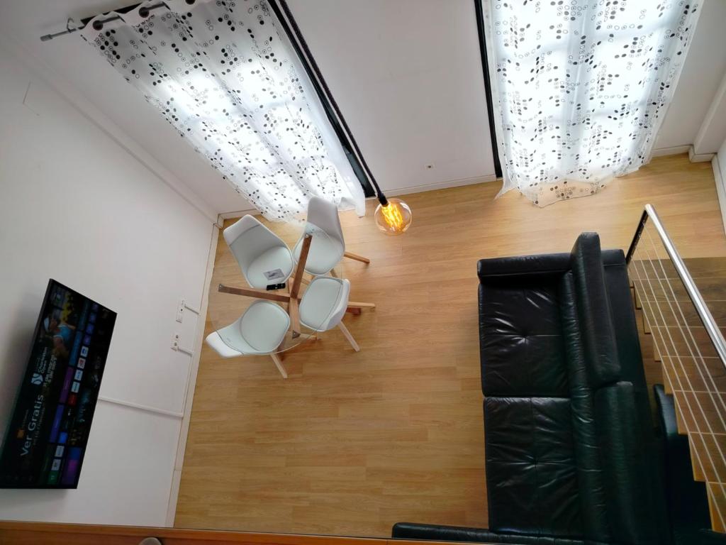 A seating area at Apartamentos Centro Cordoba by MiRa