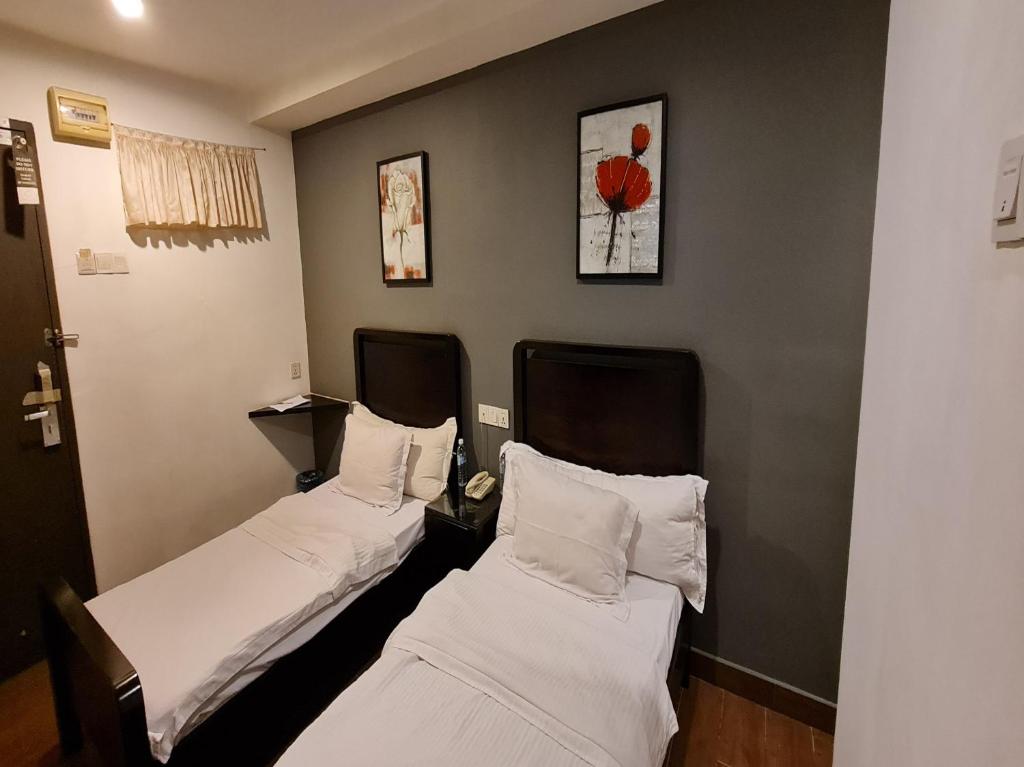 Postel nebo postele na pokoji v ubytování Hotel O Crossroads Hotel