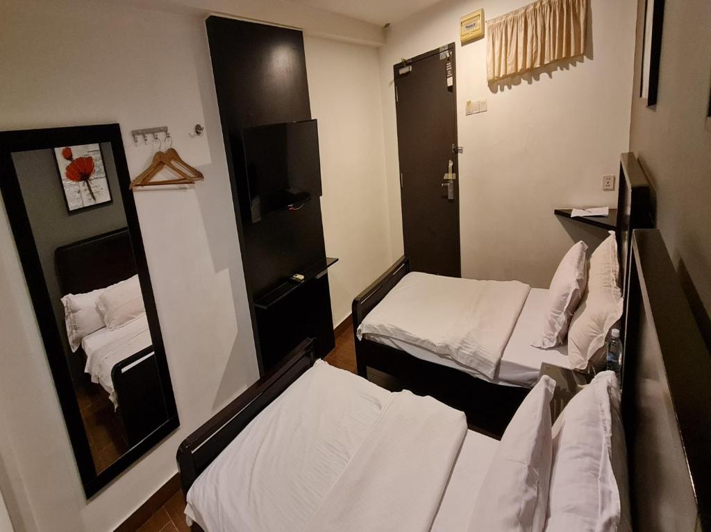 Postel nebo postele na pokoji v ubytování Hotel O Crossroads Hotel