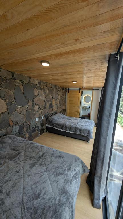 Postel nebo postele na pokoji v ubytování Cabaña La Finca Mazamitla