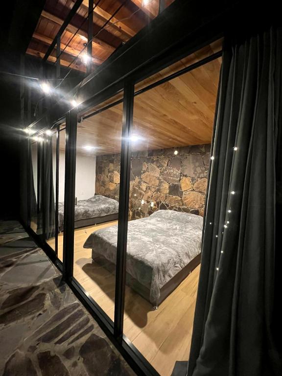 Postel nebo postele na pokoji v ubytování Cabaña La Finca Mazamitla