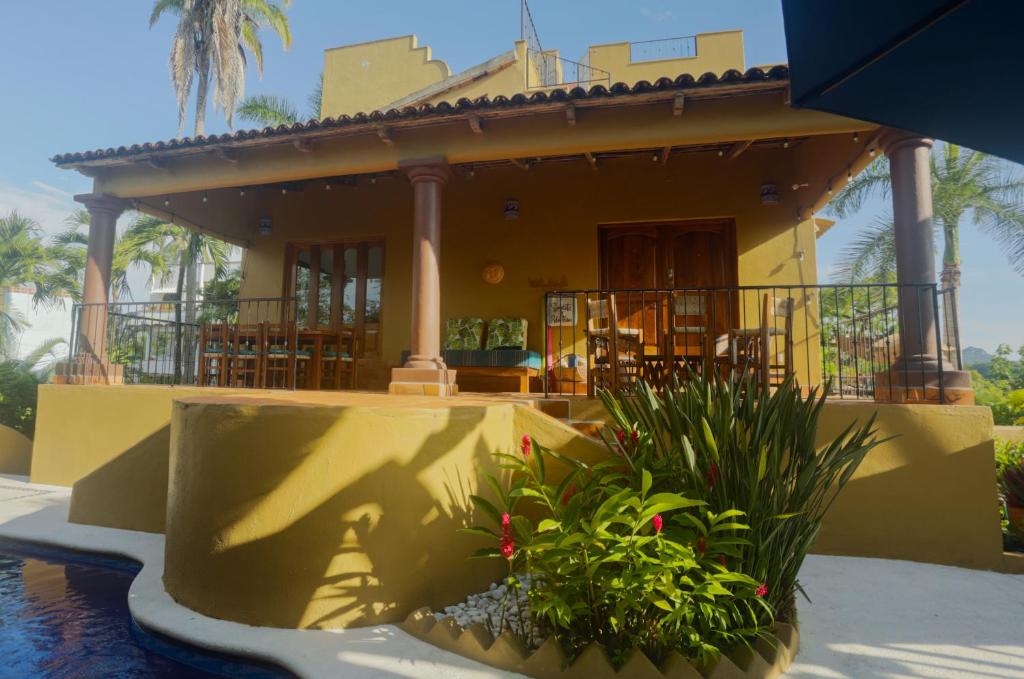 a house with a pool in front of it at Tranquil Home On Gringo Hill Sayulita in Sayulita