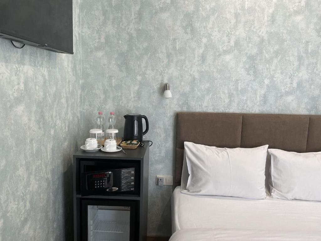 Postel nebo postele na pokoji v ubytování Hotel Flames