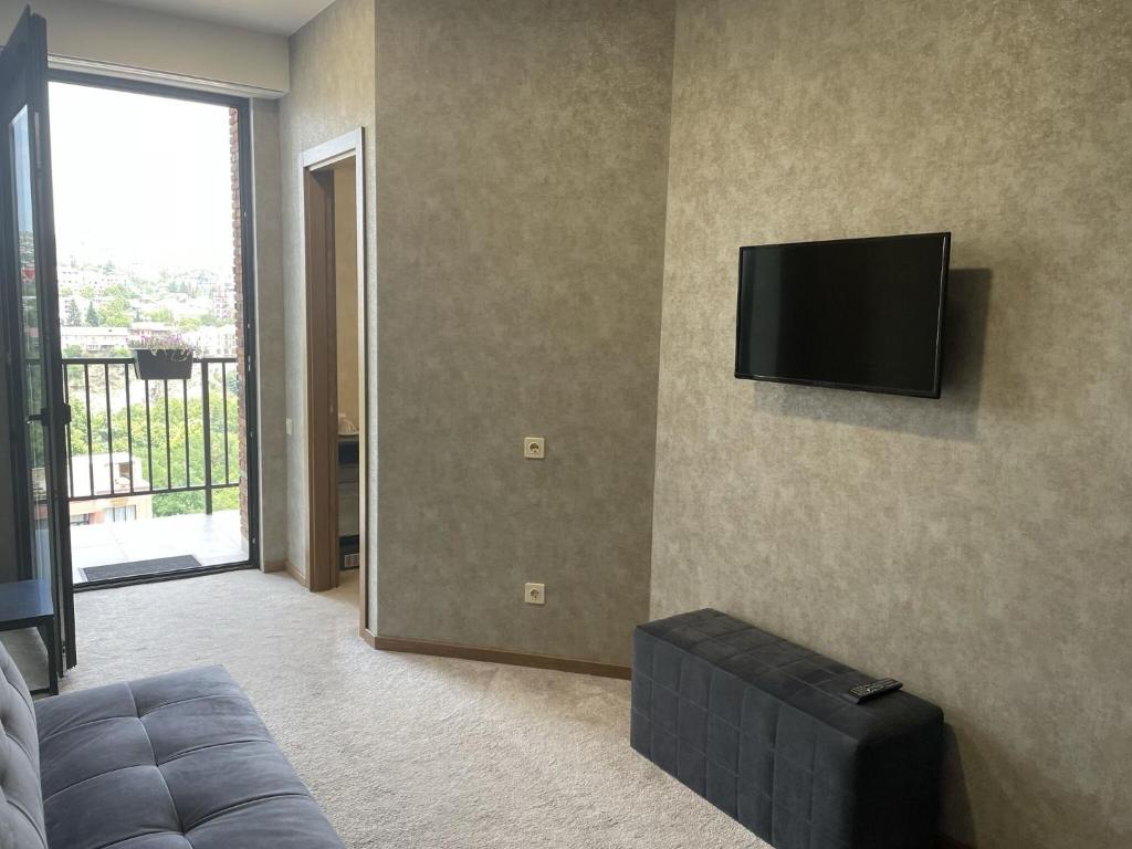 TV a/nebo společenská místnost v ubytování Hotel Flames
