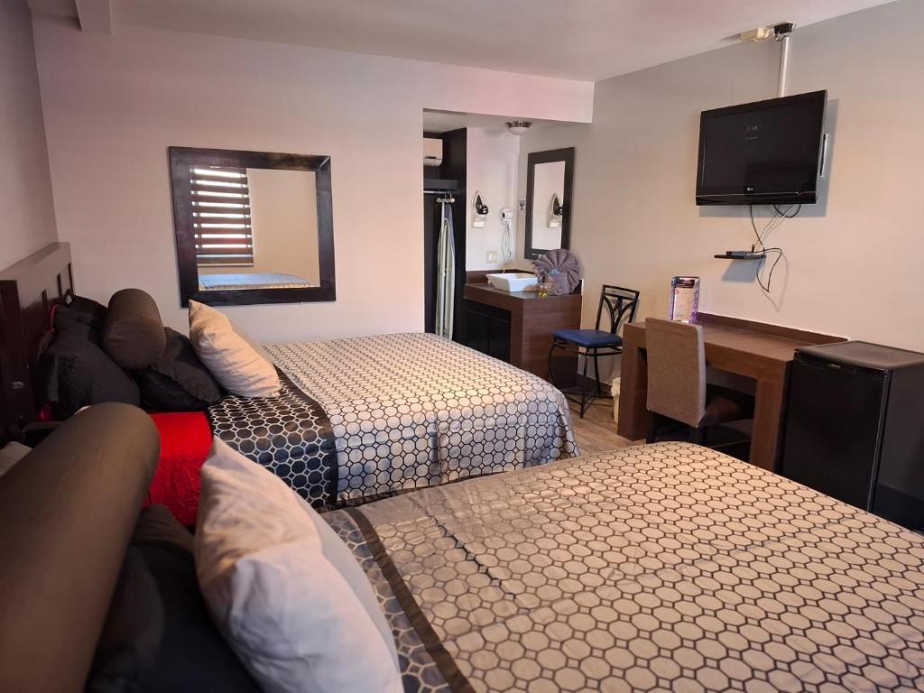 Postel nebo postele na pokoji v ubytování Lizvan Hotel-Motel