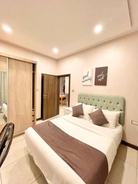 Postel nebo postele na pokoji v ubytování Skynest Residences Nairobi, Westlands