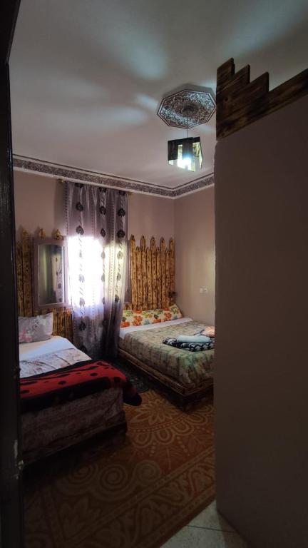 Postel nebo postele na pokoji v ubytování Myhouse Todgha