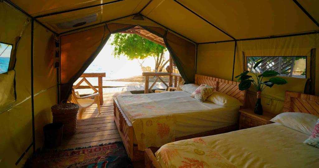 Postel nebo postele na pokoji v ubytování Glamping EcoLodge Cueva De Las Aguilas
