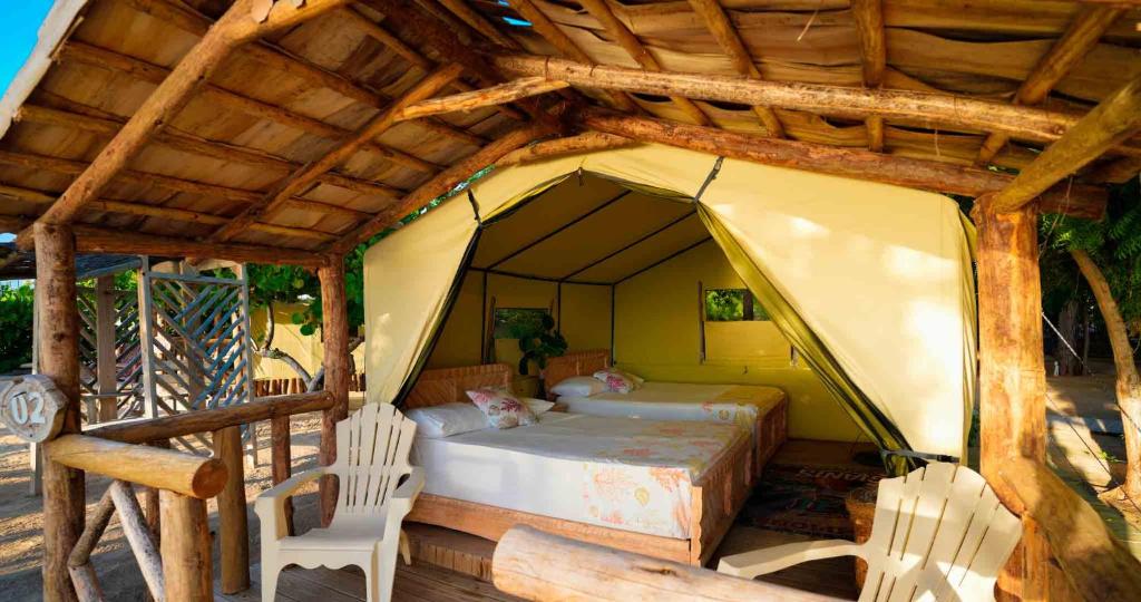 Postel nebo postele na pokoji v ubytování Glamping EcoLodge Cueva De Las Aguilas