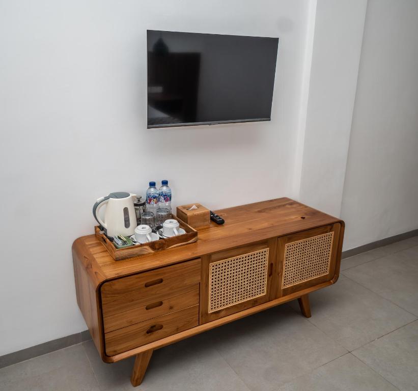 TV a/nebo společenská místnost v ubytování Kemari Ubud