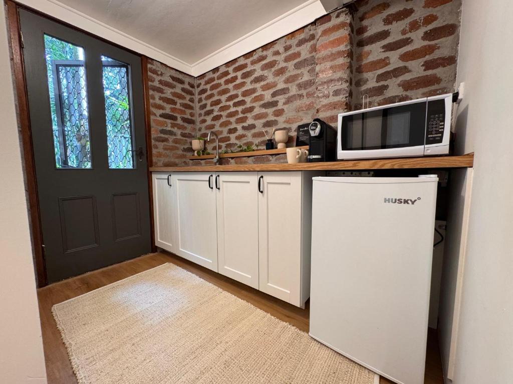 Kuchyň nebo kuchyňský kout v ubytování Rainforest Hideaway