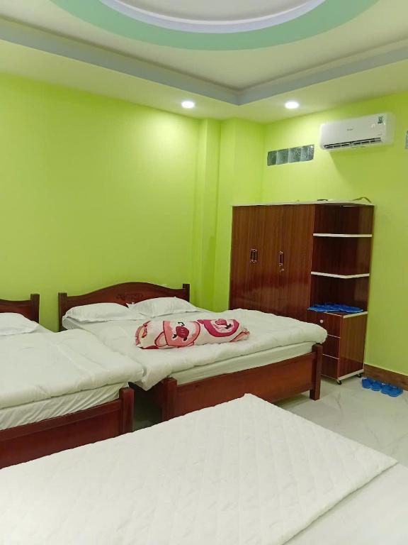 Postel nebo postele na pokoji v ubytování HoTel MoTeL ĐỒNG KHỞI