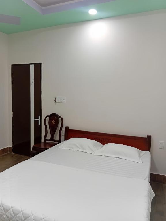 Postel nebo postele na pokoji v ubytování HoTel MoTeL ĐỒNG KHỞI