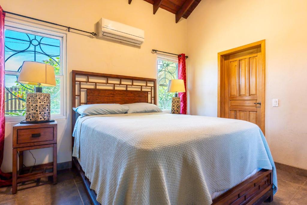 Postel nebo postele na pokoji v ubytování Casa De Odisea