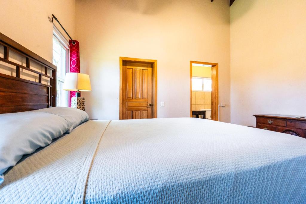 Postel nebo postele na pokoji v ubytování Casa De Odisea