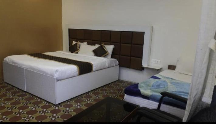 Postel nebo postele na pokoji v ubytování Celestial Resorts