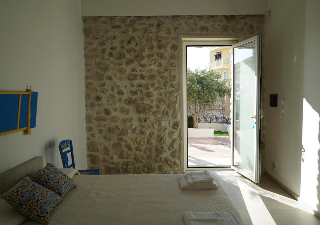 Posteľ alebo postele v izbe v ubytovaní Casa Vacanze Brezza di Gaffe