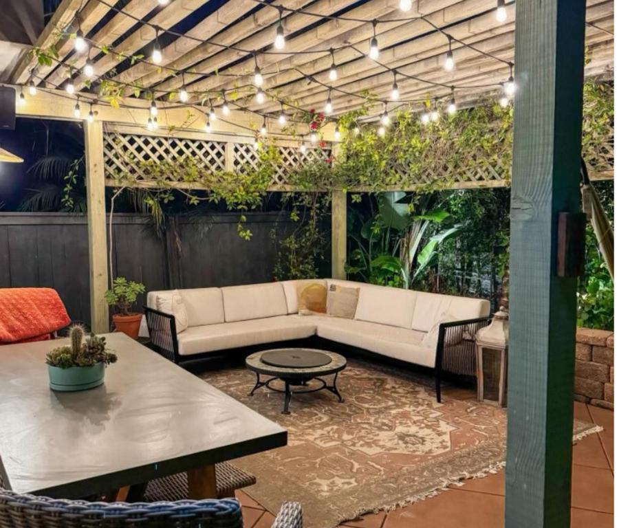 a patio with a couch and a table at Sweet Serenity 3 bed with community pool, spa in Encinitas