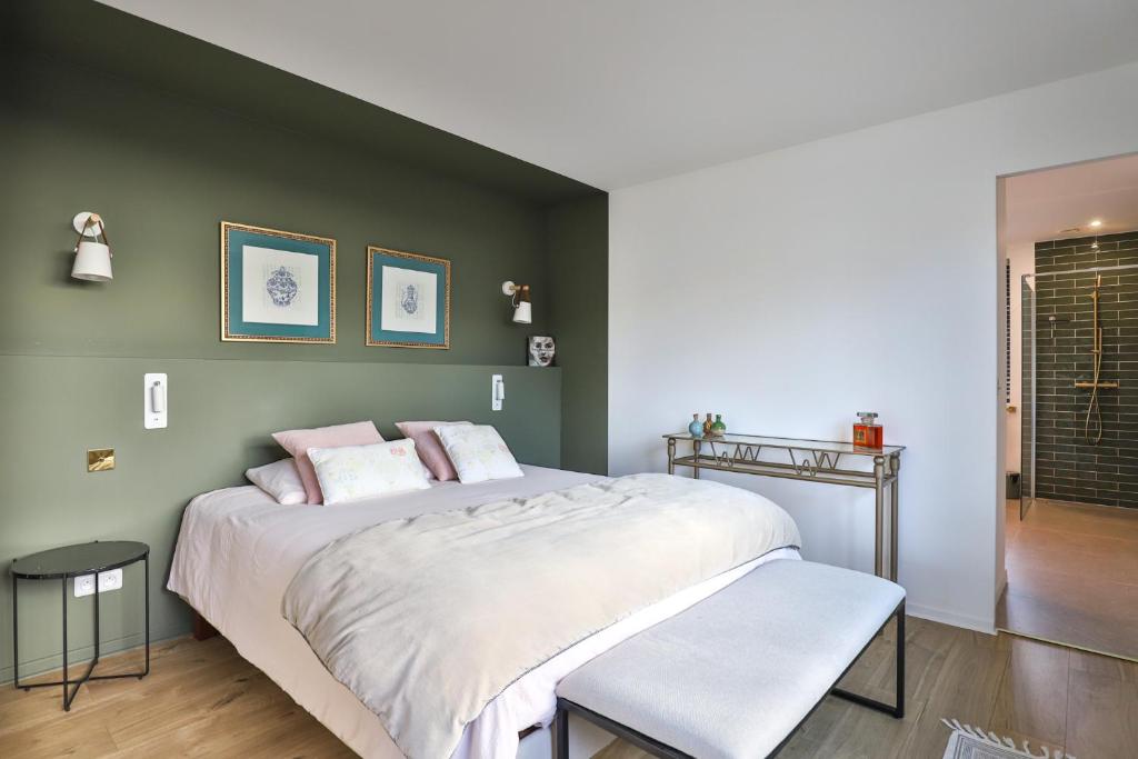 Ένα ή περισσότερα κρεβάτια σε δωμάτιο στο CHAMBRE D'HOTES Villa BIBICHERI