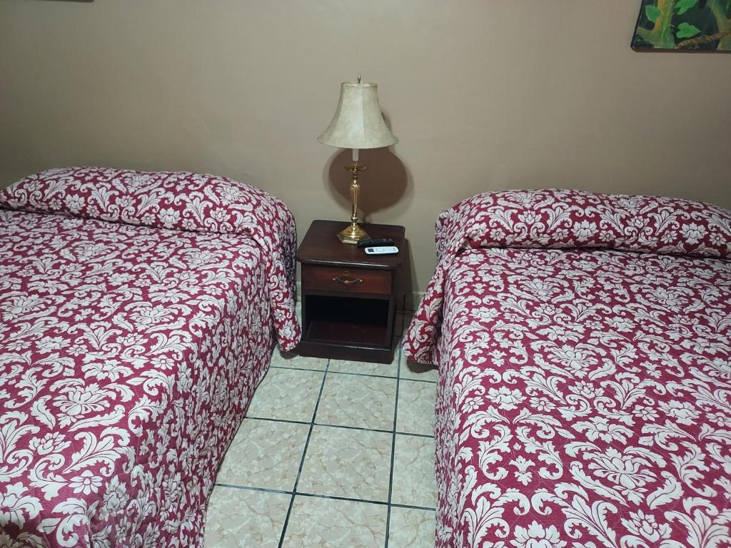 Postel nebo postele na pokoji v ubytování Hotel La Escalinata