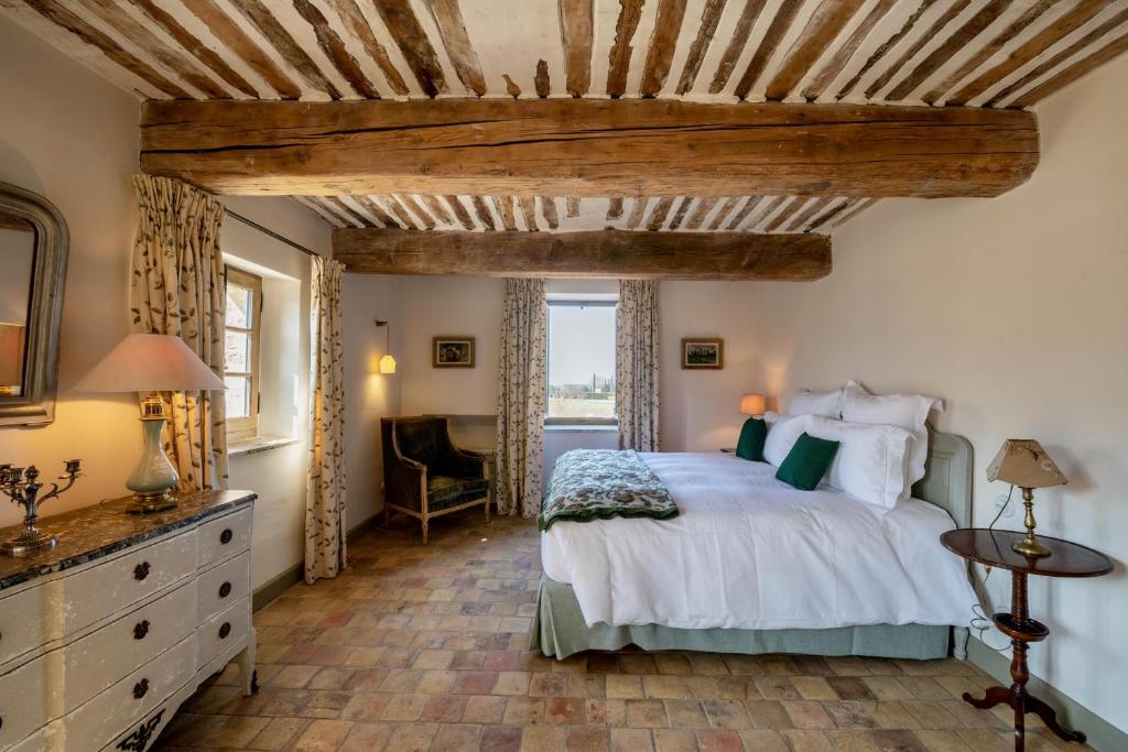Postel nebo postele na pokoji v ubytování La Bastide