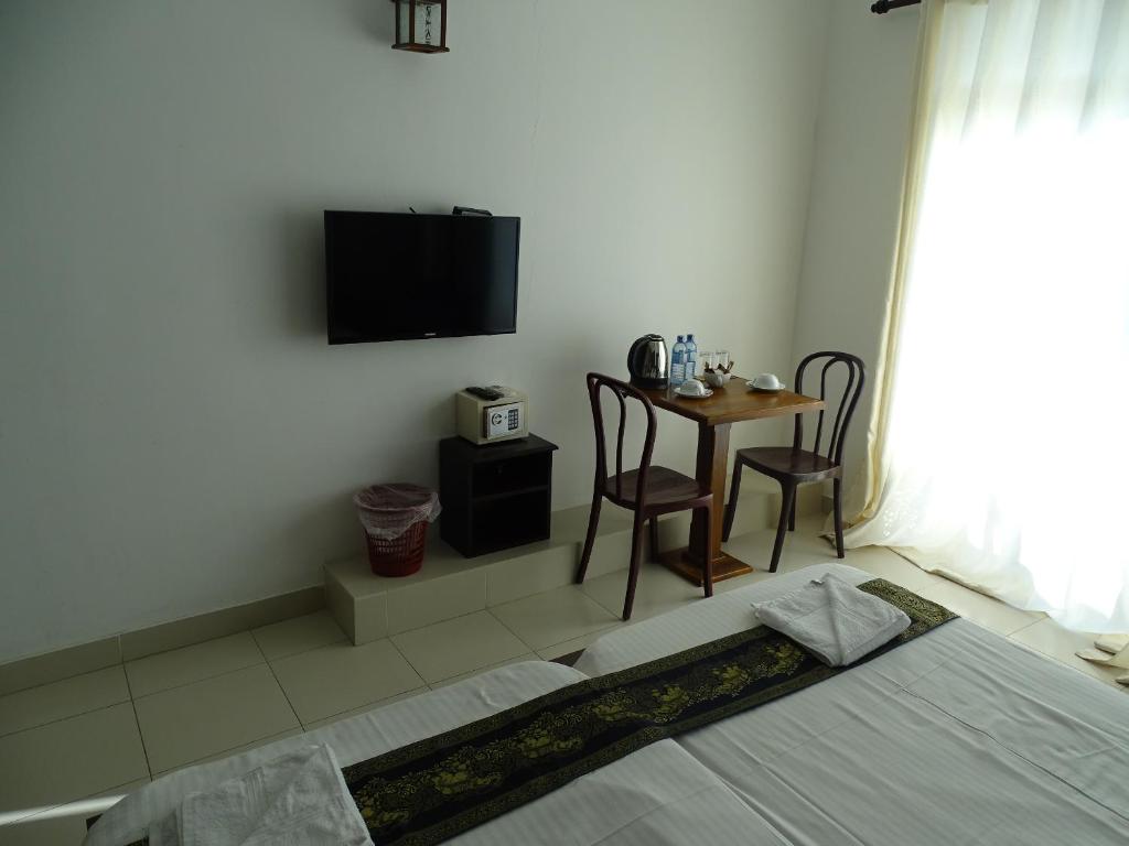 TV a/nebo společenská místnost v ubytování Kandy Supreme Hotel