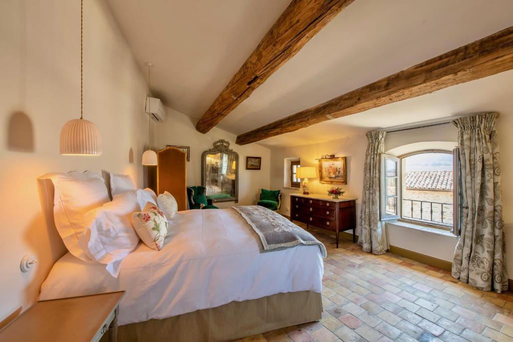 Postel nebo postele na pokoji v ubytování La Bastide